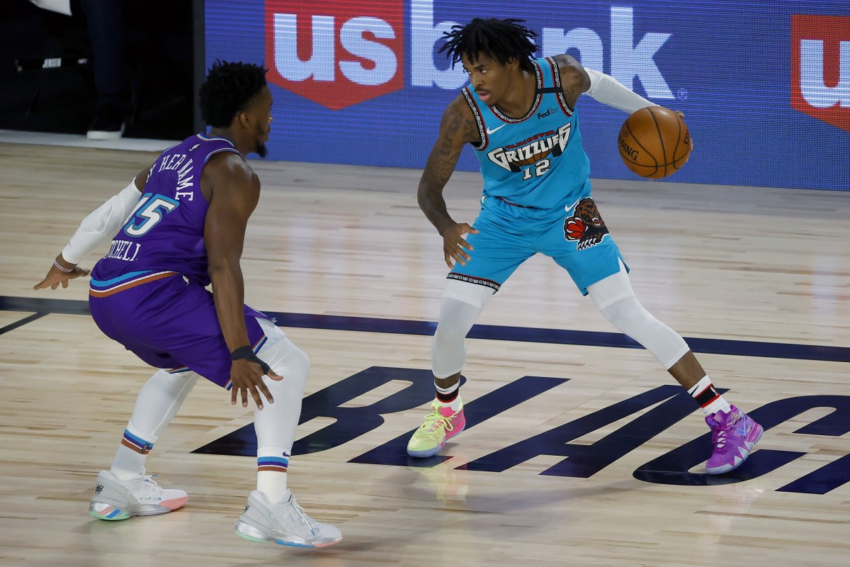 Donovan Mitchell (45) and Ja Morant (12) go toe-to-toe during last years matchup in the "NBA Bubble"